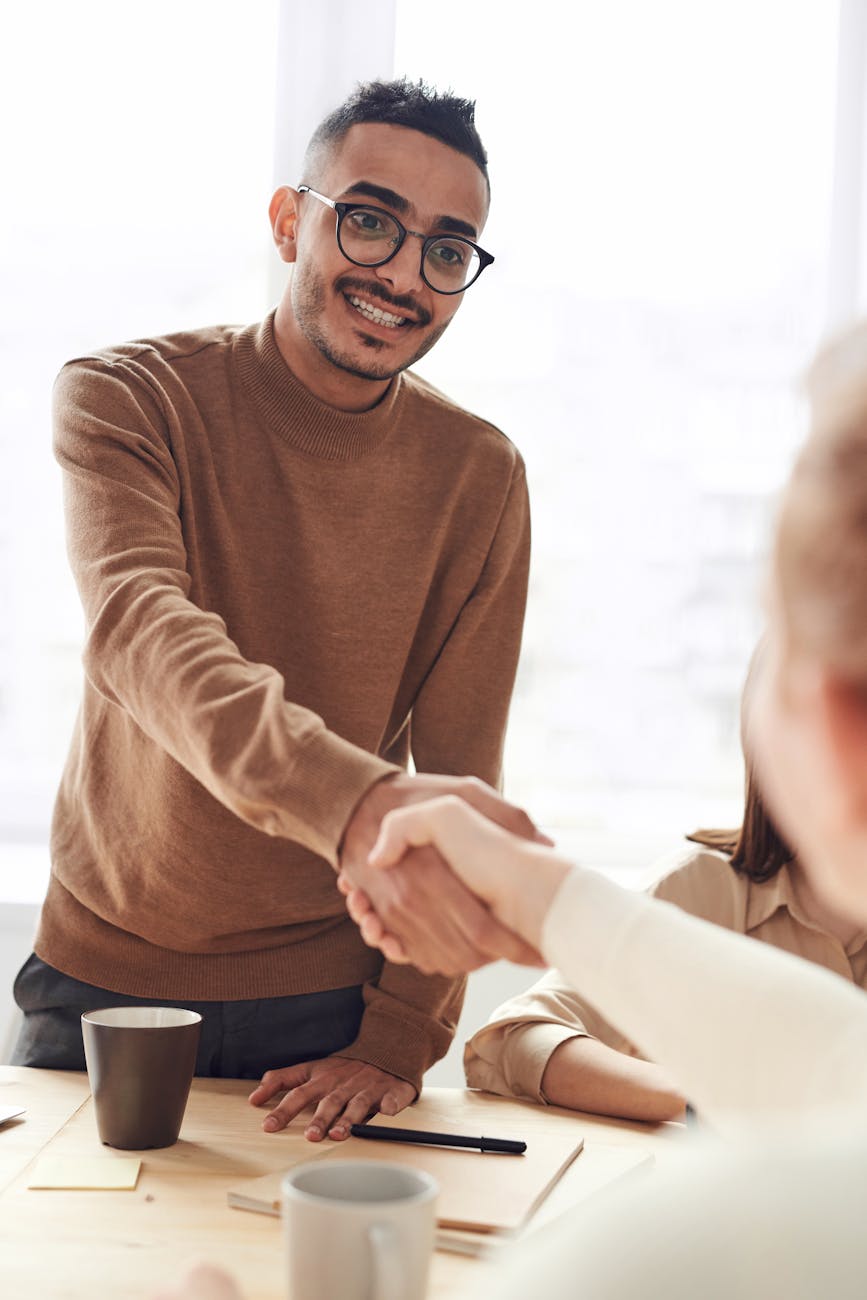 Happy landlord shaking hands with a professional property manager, symbolizing trusted lettings and property management services in Worcestershire.